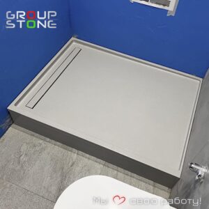 Заказать душевой поддон из искусственного камня: эстетика натуральной фактуры и безупречная прочность.